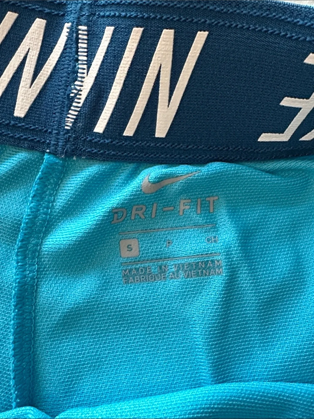Nike Turquoise Performance Shorts with White Swoosh